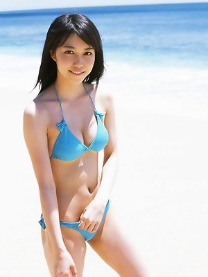 Petite gravure babe shows off her delicious body in a blue bikini